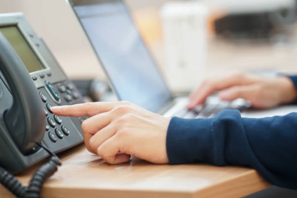 Office user setting up physical IP phone