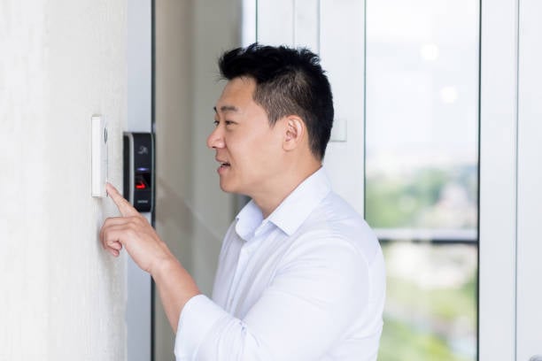Office staff using indoor intercom system