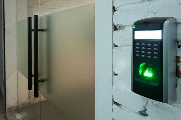 access control reader installed beside office glass door